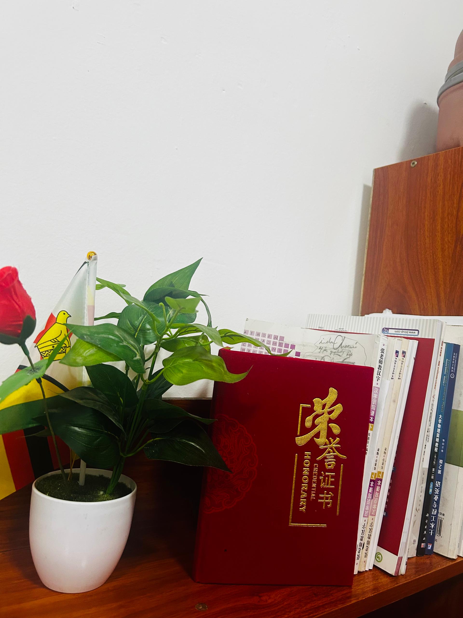 Study desk with honor certificate, books and flags